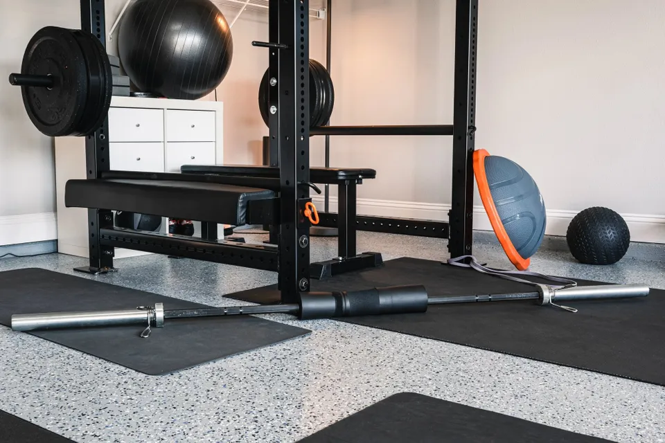 Home gym with epoxy flake flooring and workout equipment