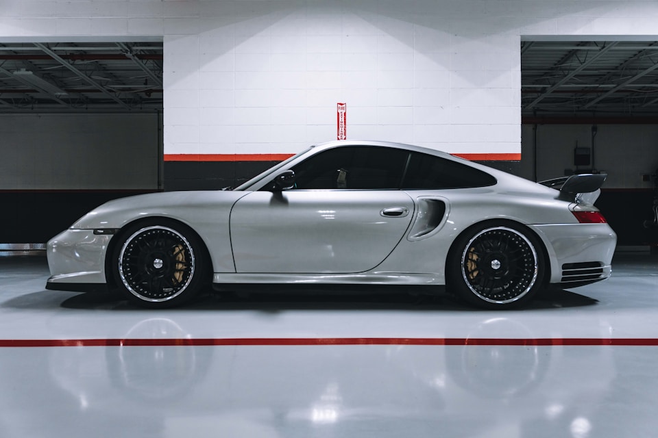 Industrial epoxy flooring with a performance car in a clean garage
