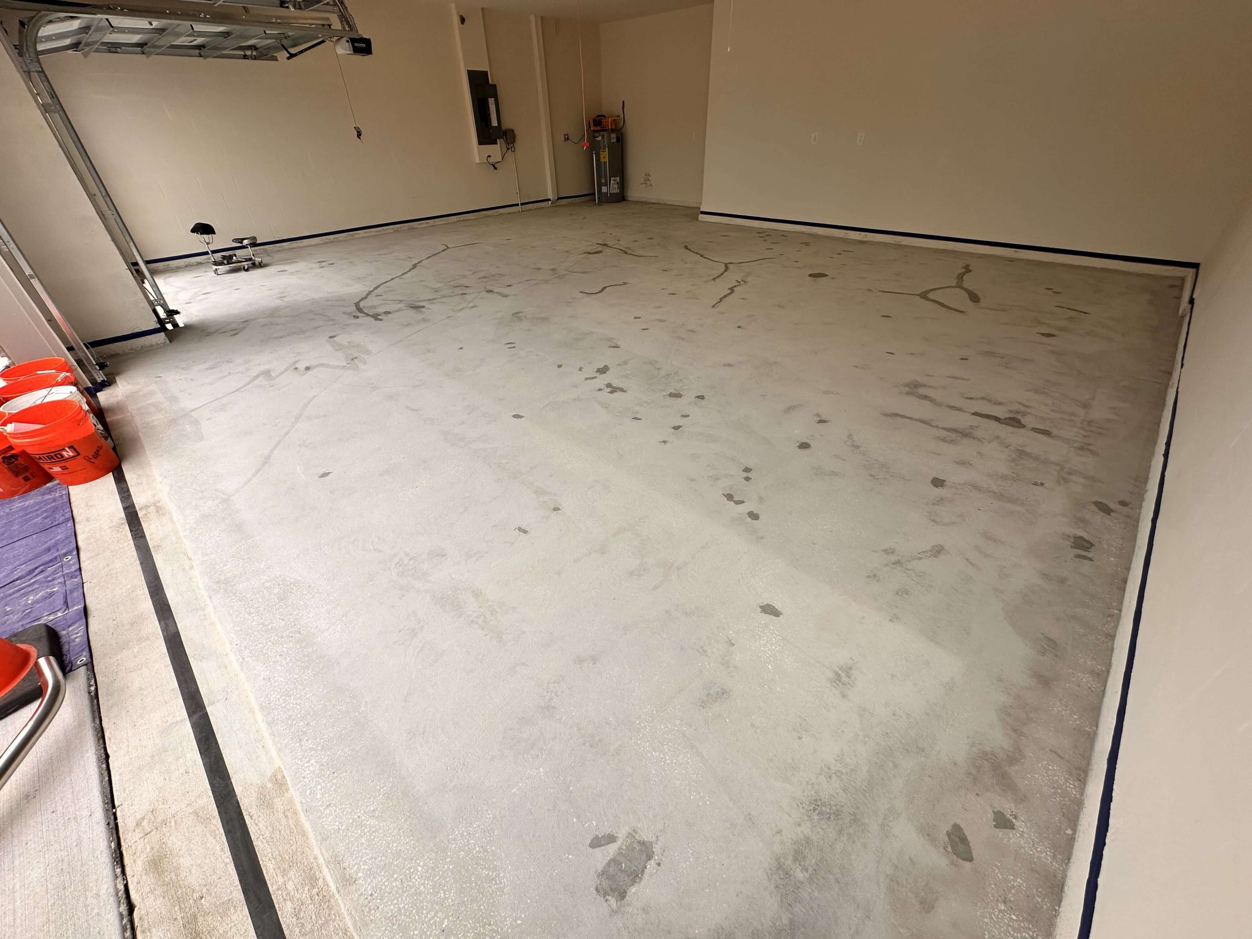 Angle view of crack-repaired garage floor during prep