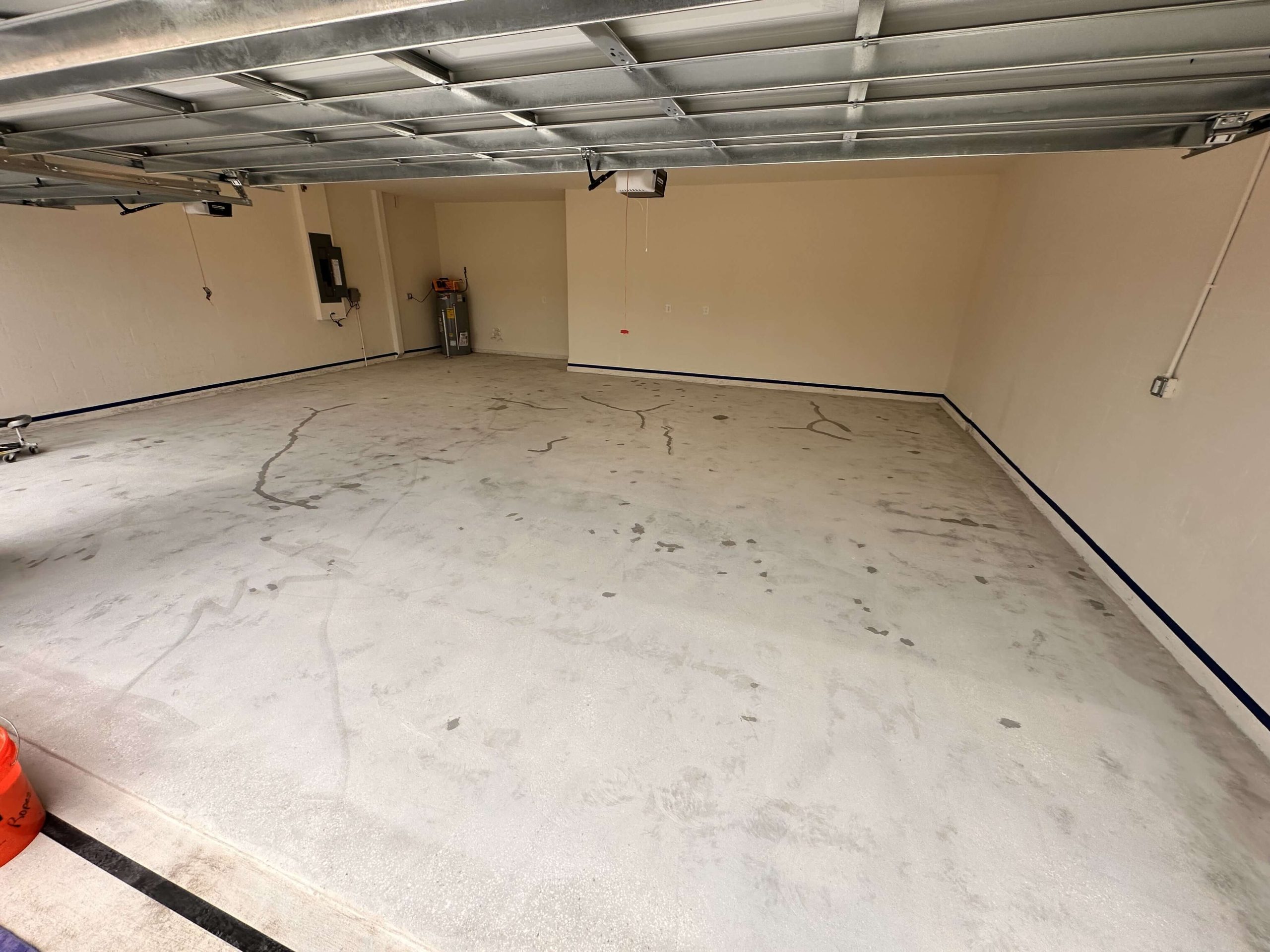 Full garage view with repaired cracks on concrete floor