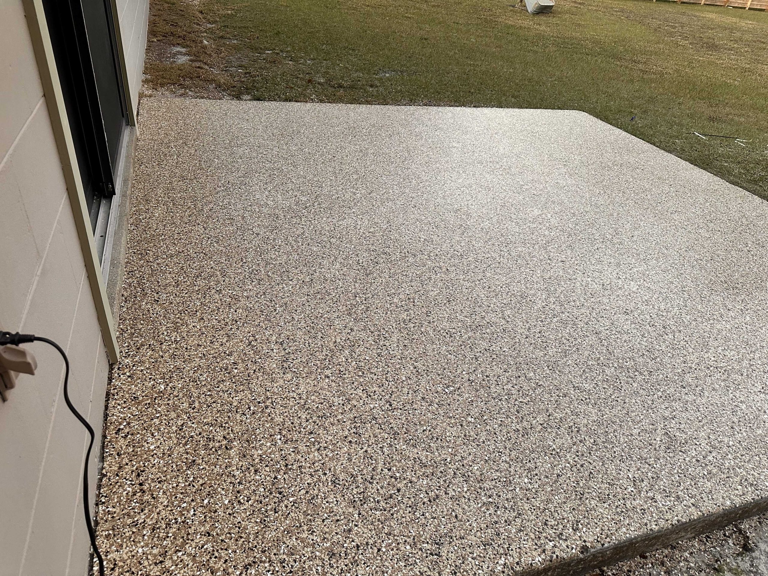 Finished epoxy flake patio floor in Lakeland, FL home.