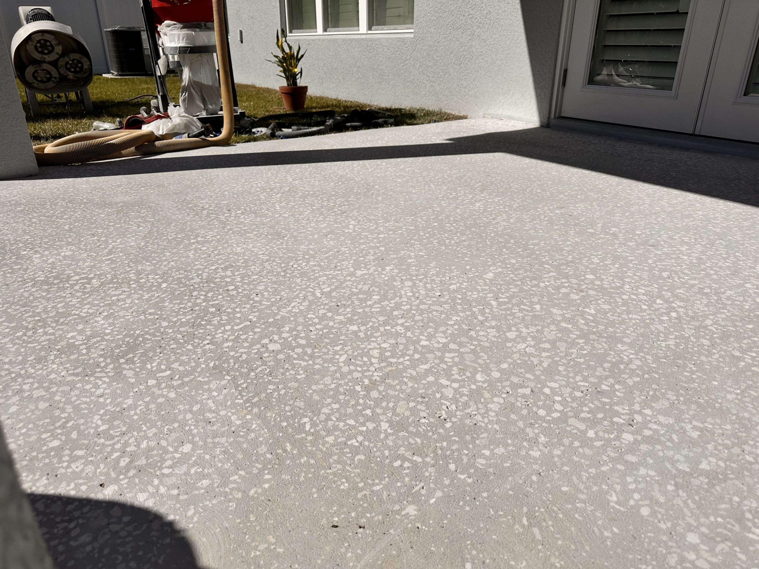 Outdoor concrete patio surface before epoxy coating application.